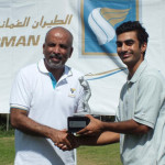 Andrew Udesh, Oman Air Trophy Winner receiving his trophy and prize from Gihan Karunaratne