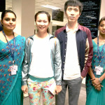 Yong-He-and-Huihua-Chen-flanked-by-airport-staff-of-SriLankan